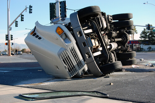 overturned truck after a major truck accident at an intersection