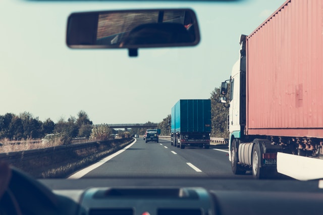 car riding in truck's blindspot