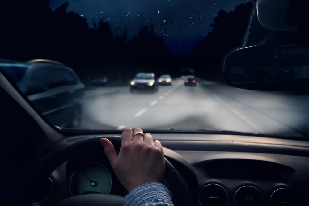 man driving in the highway at night