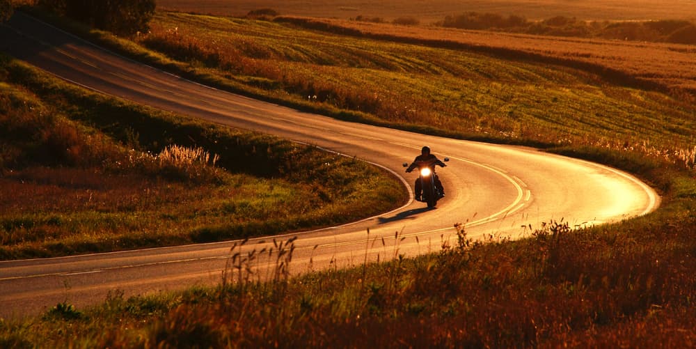 driving a motorcycle during sunset