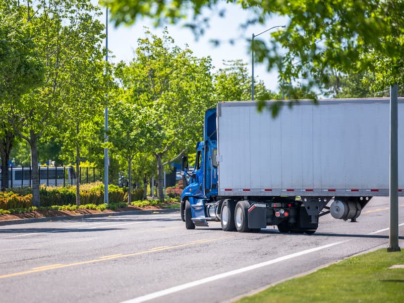 big rig semi truck making a wide right turn