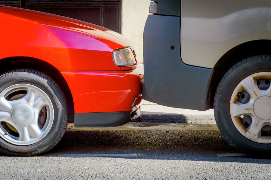 car tightly parked on the street