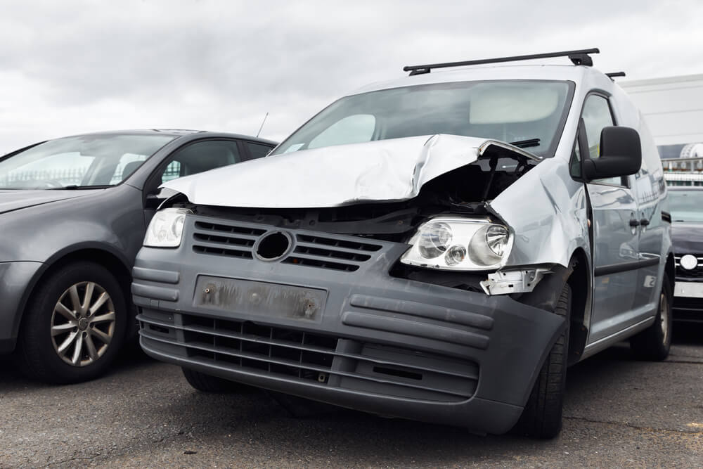Badly damaged van right off in commercial vehicle recycling or insurance pound