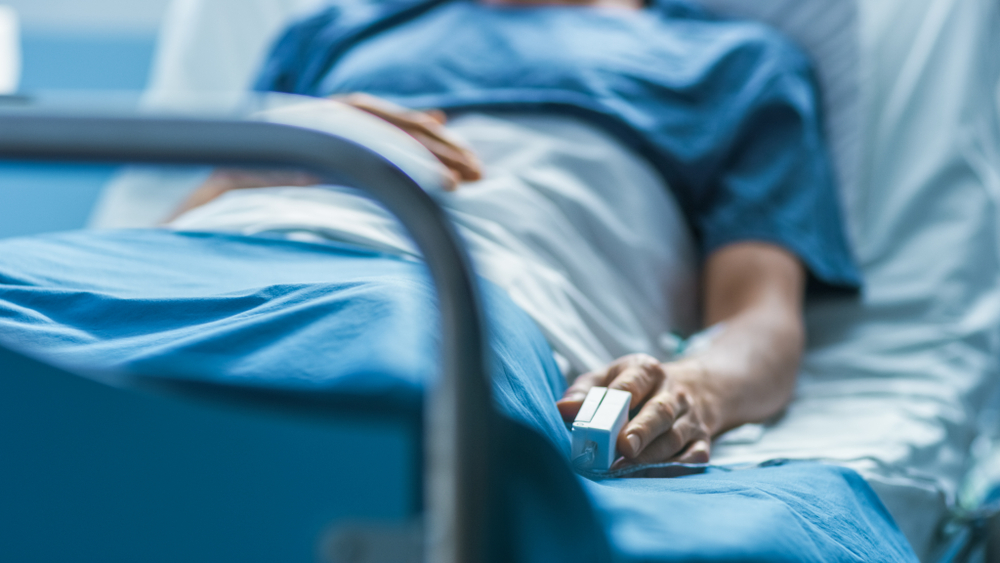 Patient lying in bed, Hospital Lien