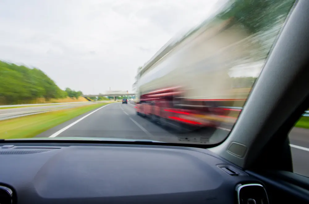 car going to overtake truck