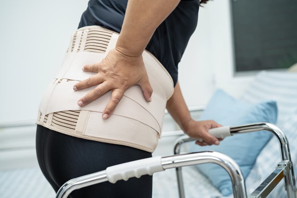 Lady Patient Wearing Back Pain Support Belt for Orthopedic