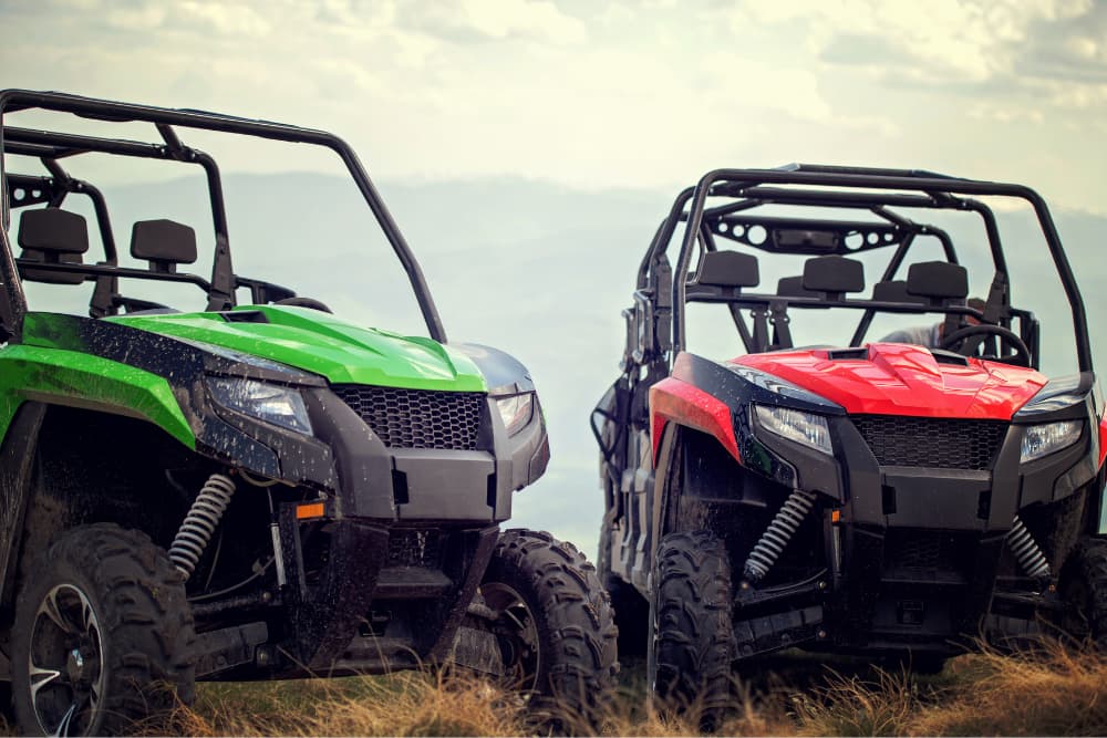 friends driving off-road with atv and utv