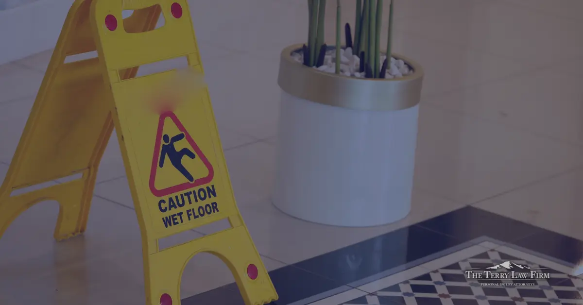 Hotel hallway with wet floor caution sign in Tennessee, illustrating hotel negligence and premises liability
